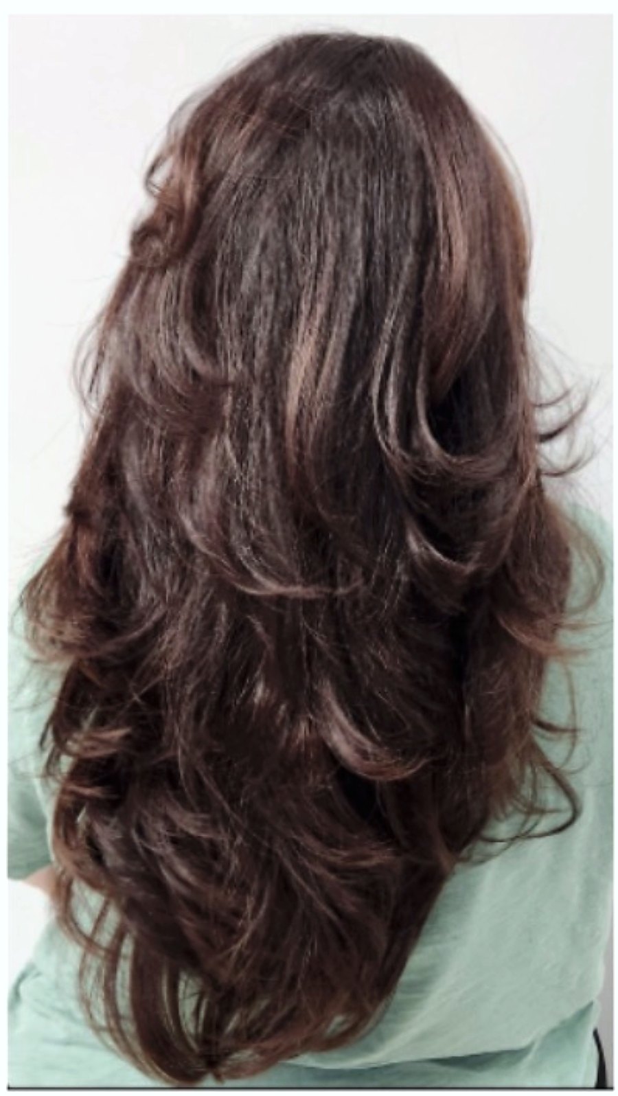 Finished cut with layered styling at A Hair Story Salon